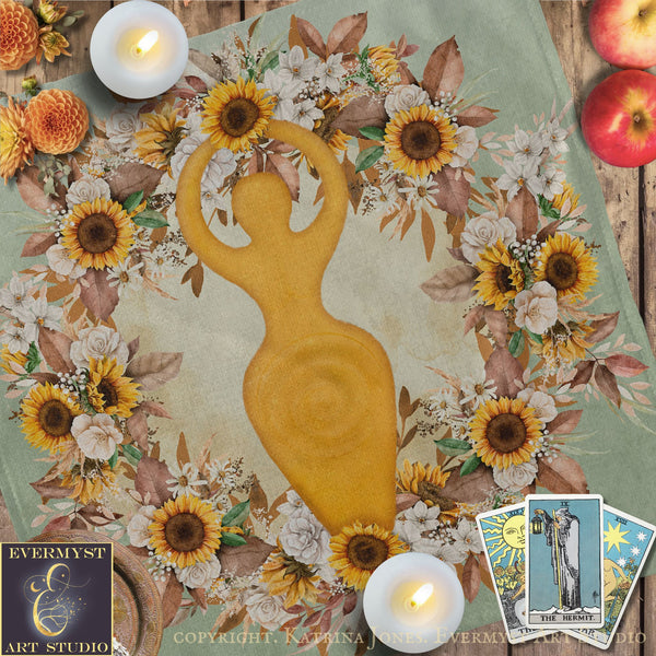 a wreath of flowers surrounding a golden figure, with candles and tarot cards placed around the scene.