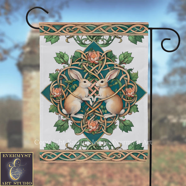 a decorative banner with a floral design and two rabbits, one brown and one white, surrounded by a circular pattern of leaves and flowers.