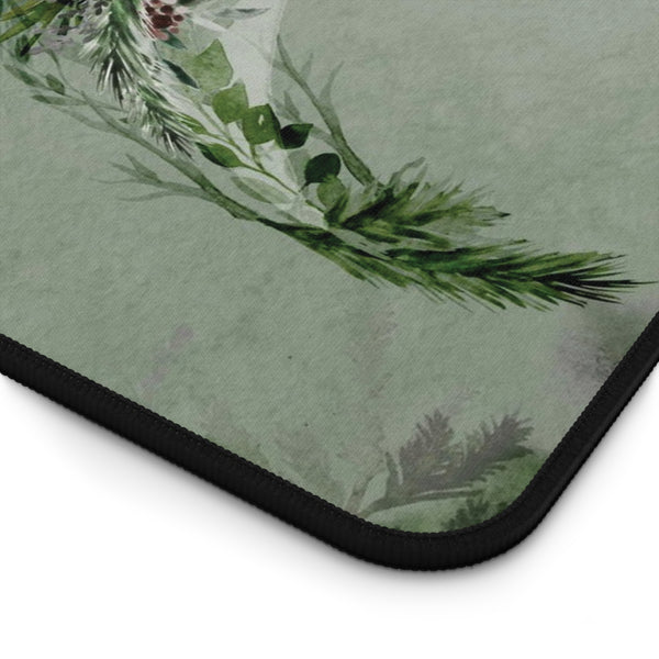 a close-up view of a green and white floral pattern on a surface, with a black border around the edge.