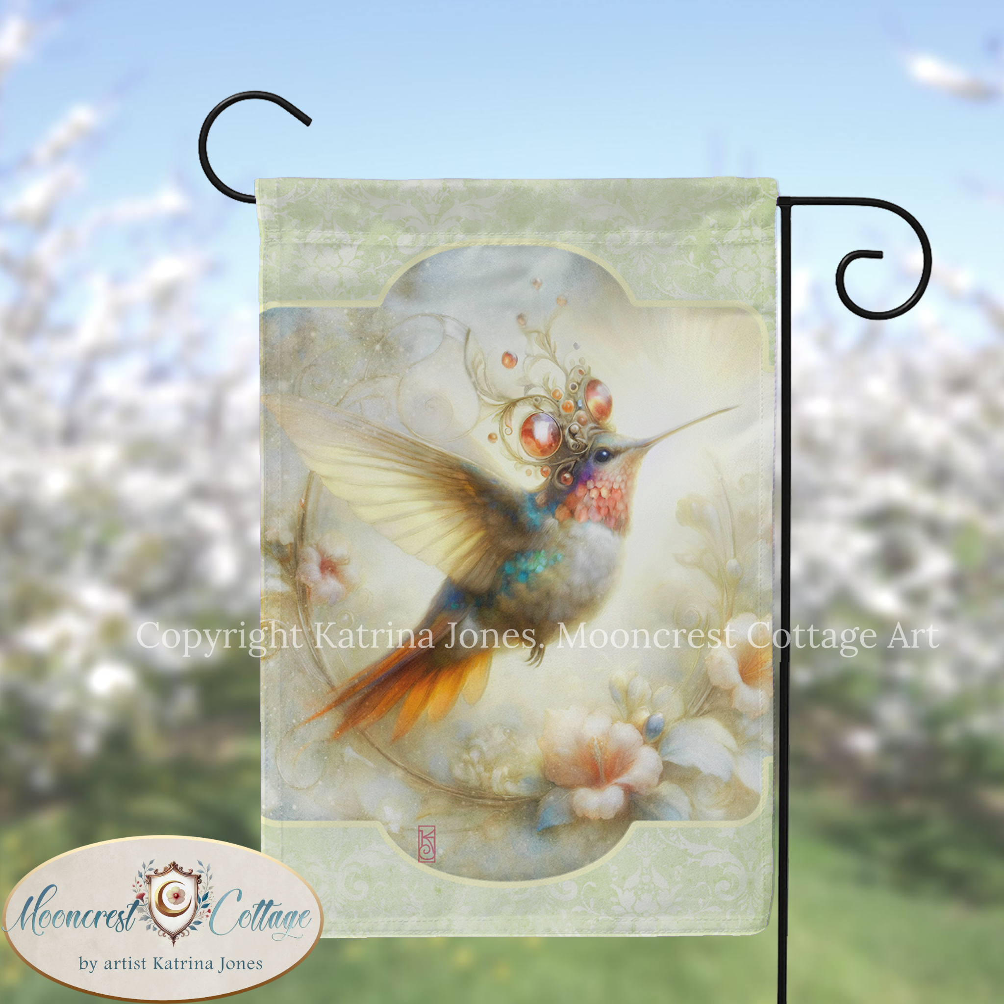 A colorful hummingbird with a decorative headdress is depicted on a flag, set against a blurred background of flowers.