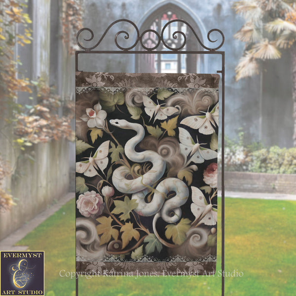 a garden scene with a decorative metal sculpture of a snake and butterflies.