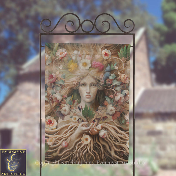 a large, ornate metal frame with a painting of a woman's face surrounded by flowers and foliage.