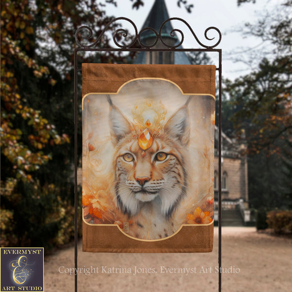 a banner with a close-up of a cat's face, possibly a longhorn, with a golden crown on its head. The background of the image is blurred, suggesting an outdoor setting with trees and a building.