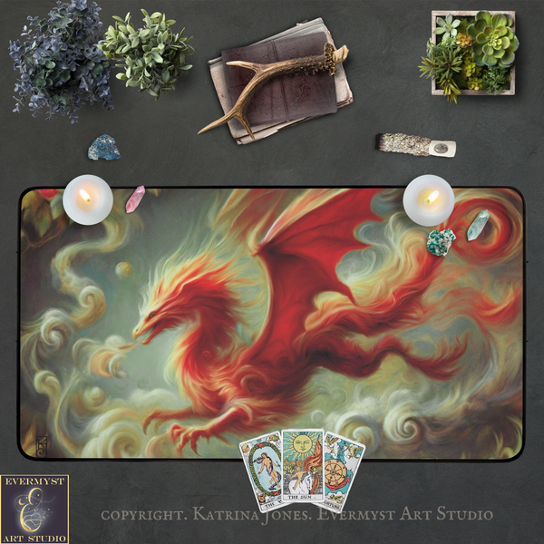 a large, vibrant dragon-like creature with fiery red and orange hues, surrounded by swirling clouds and flames. The dragon is depicted in a dynamic pose, with its wings spread wide and its tail curled up. The dragon is set against a dark background, which contrasts with its vivid colors. The image also includes various objects such as a book, a candle, and a deck of playing cards, as well as a small plant and a piece of driftwood.