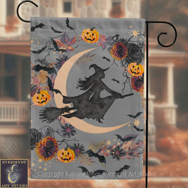 A Halloween-themed flag with a silhouette of a witch on a broomstick, surrounded by pumpkins, flowers, and bats against a crescent moon backdrop.