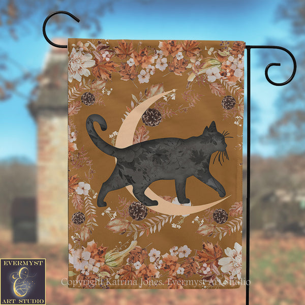 A black cat silhouette is depicted walking on a crescent moon, surrounded by autumn foliage and flowers, with a brick tower in the background.