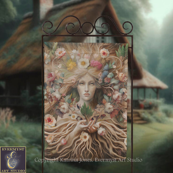 a large, ornate metal sign with a painting of a woman's face surrounded by flowers and foliage. The background is blurred, suggesting a garden or outdoor setting.