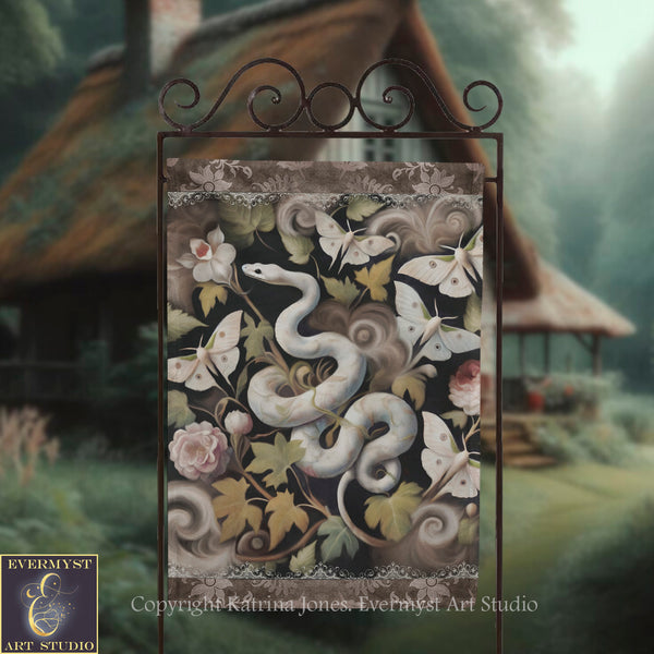 a decorative sign with a snake and butterflies, set against a lush, natural background.