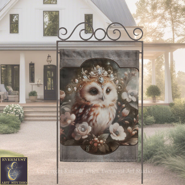 a banner with an owl wearing a crown of flowers, displayed in front of a white house with a porch.