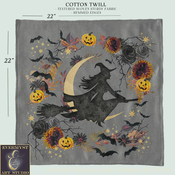 The image is a square-shaped piece of fabric with a Halloween-themed design featuring a silhouetted witch on a broomstick, surrounded by various fall-themed elements such as pumpkins, flowers, and bats.