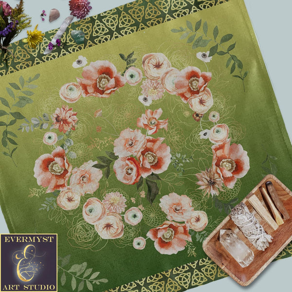 a green table cloth with flowers on it