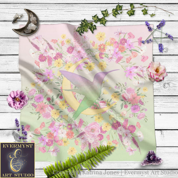 a blanket with flowers and a bird on it