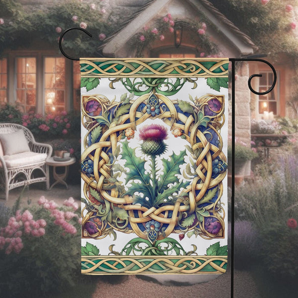 a garden flag with a picture of a thistle