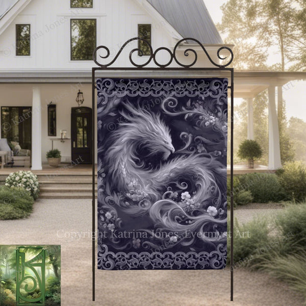 a large, ornate dragon design on a black metal stand, with a white house and greenery in the background.