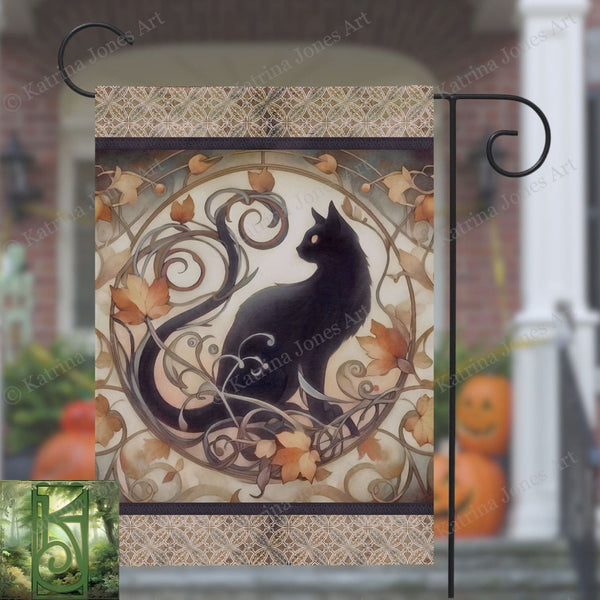 a black cat sitting on top of a metal pole