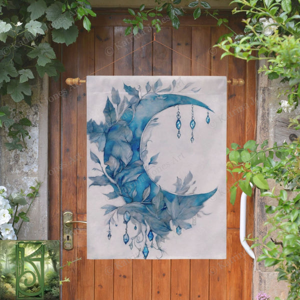 a painting of a blue moon hanging on a wooden door