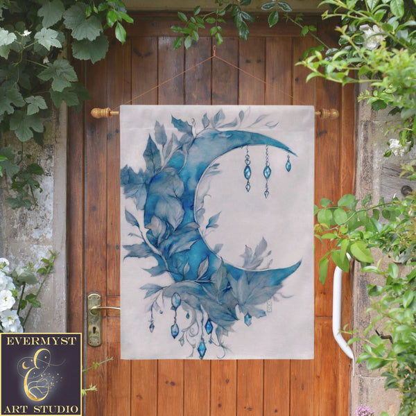 a painting of a blue moon hanging on a wooden door