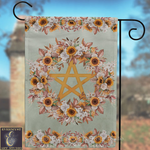 a banner with a floral design and a star, hanging on a metal hook.