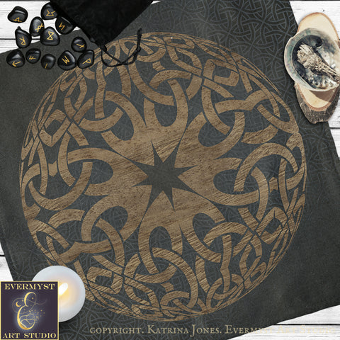 a large, intricate design with a central star and a complex pattern of interlocking lines and shapes, all set against a dark background. The design appears to be a mandala or a similar type of artwork.