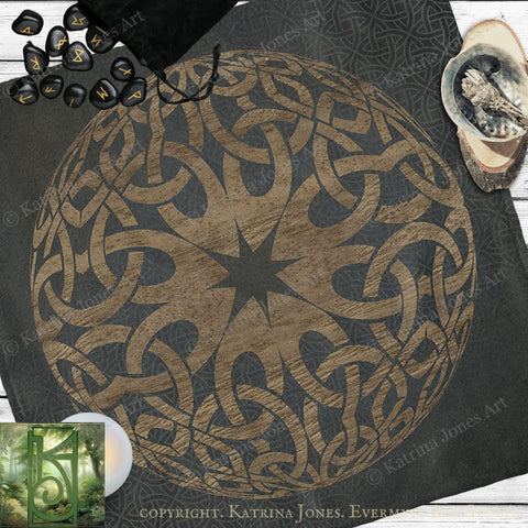 a large, intricate design with a central star and a complex pattern of interlocking lines and shapes, all set against a dark background. The design appears to be a mandala or a similar type of artwork.