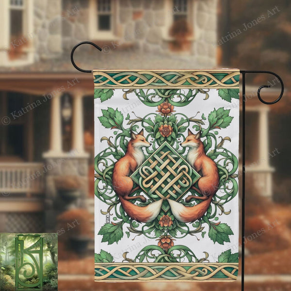 a decorative flag hanging from a metal pole