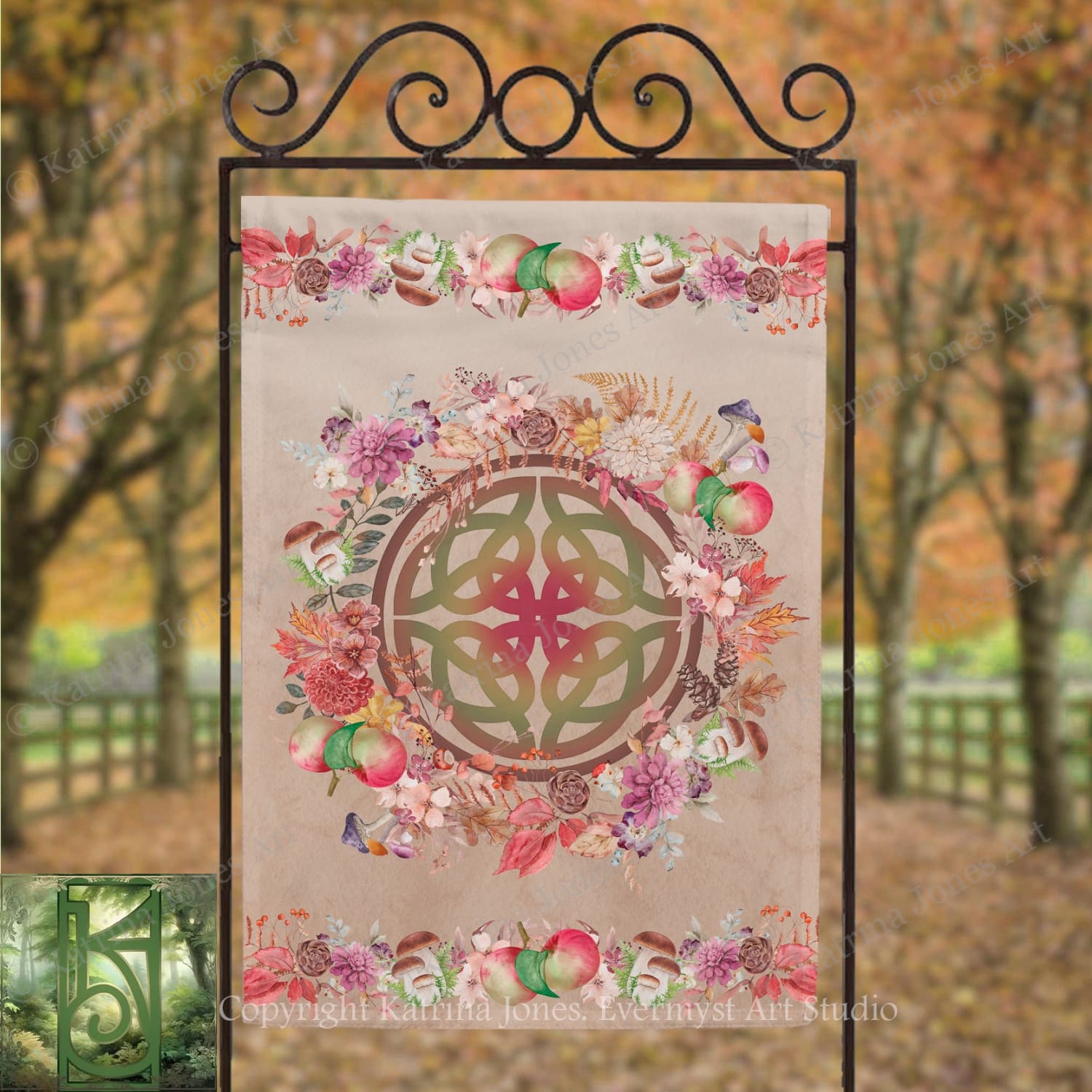 a banner with a circular design and a floral border, hanging in an outdoor setting with trees in the background.