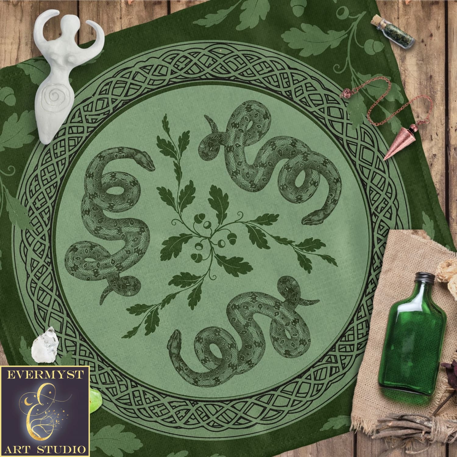 a green table cloth with a picture of a snake on it