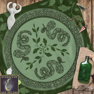 a green table cloth with a picture of a snake on it