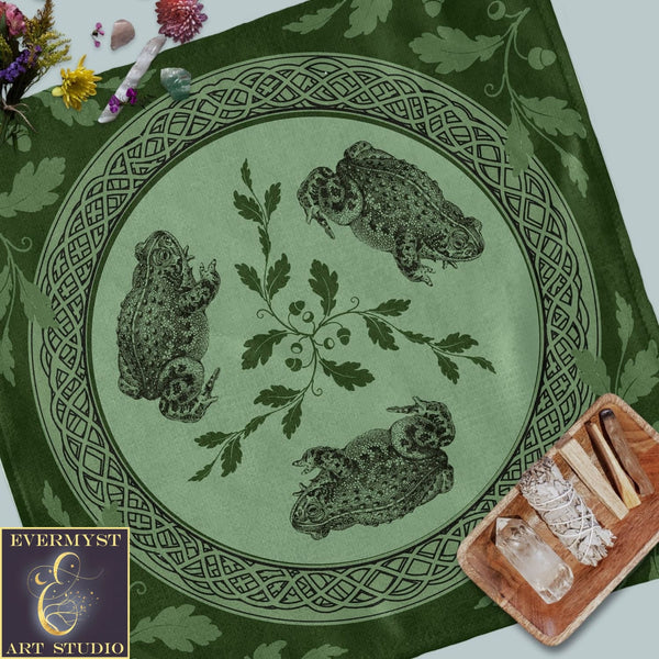 a green table cloth with a picture of two owls on it