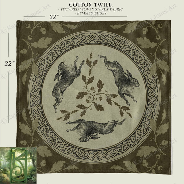 a black and white photo of a cloth with a picture of rabbits on it