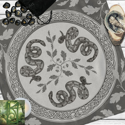 a picture of a snake on a table next to a candle