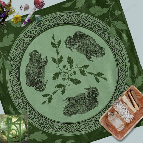 a green table cloth with a picture of two owls on it