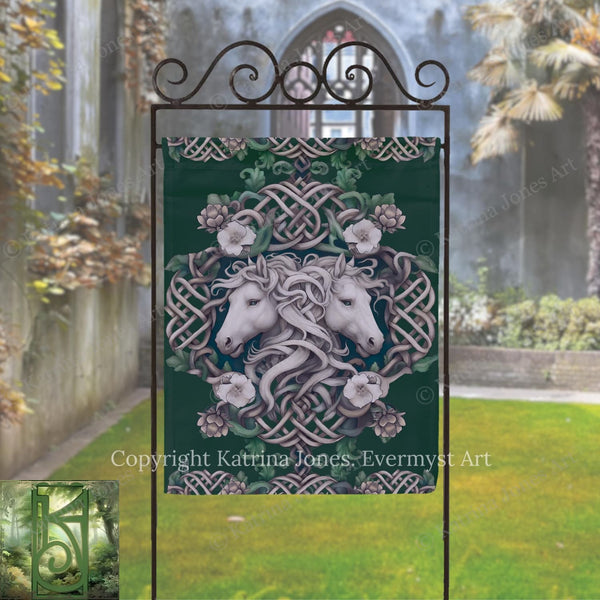 a banner with a white horse and floral design, displayed outdoors in front of a building with a stone archway.