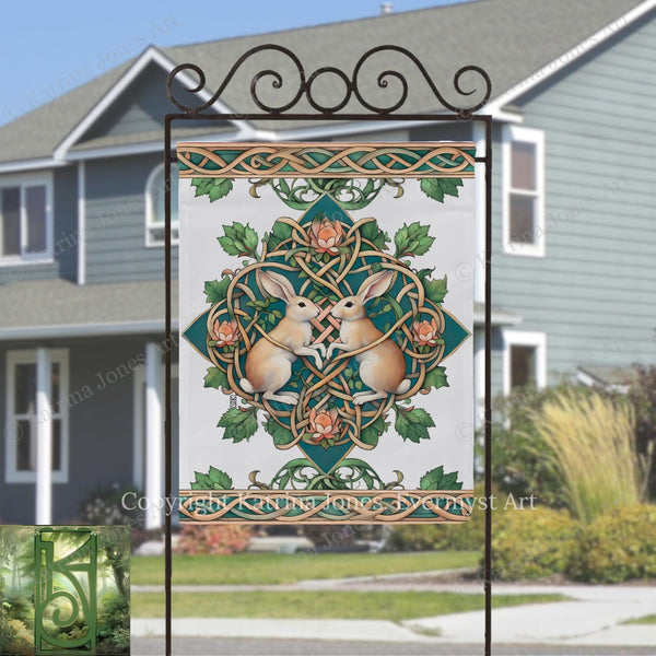 a decorative sign with a rabbit and a heart-shaped design, placed in front of a house.