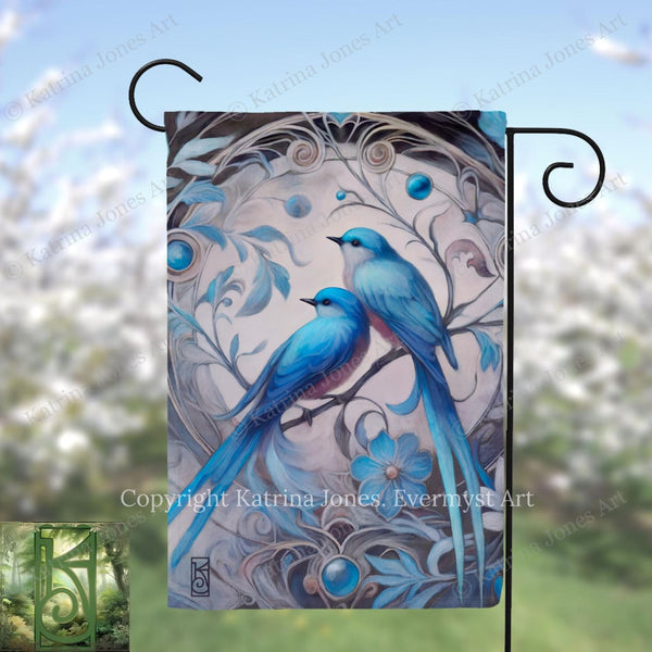 A flag featuring a painting of two blue birds perched on a branch, surrounded by intricate floral designs and blue gemstones.