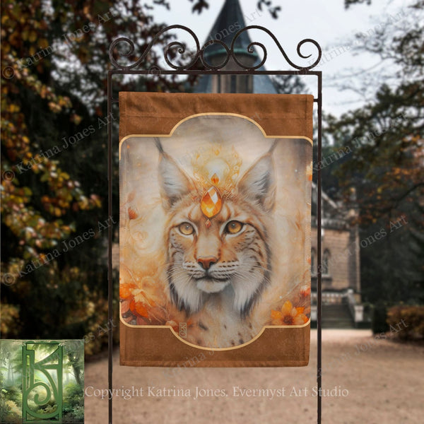 a banner with a close-up of a cat's face, possibly a longhorn, with a golden crown on its head. The background of the image is blurred, suggesting an outdoor setting with trees and a building.