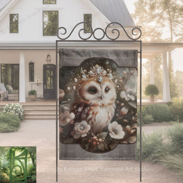 a banner with an owl wearing a crown of flowers, displayed in front of a white house with a porch.