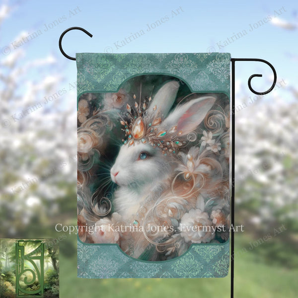 A decorative Easter bunny garden flag with a floral pattern and a large, detailed image of a white rabbit wearing a crown and surrounded by flowers.