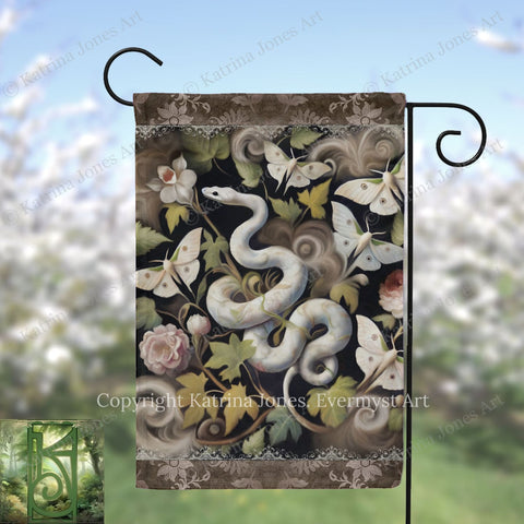 A decorative garden flag featuring a snake surrounded by various flowers, butterflies, and leaves.