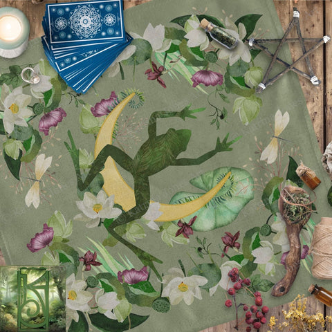 a blanket with a lizard and flowers on it