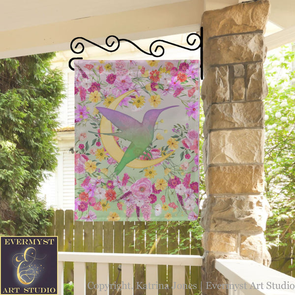 a picture of a hummingbird on a wall hanging on a porch