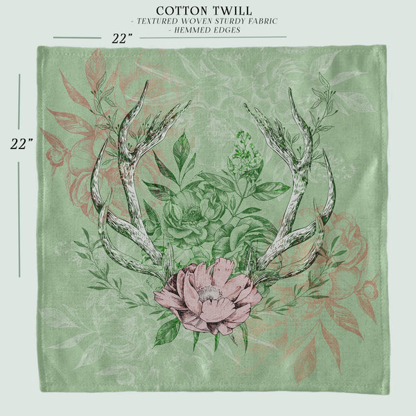 a picture of a deer&#39;s antlers and flowers on a green background