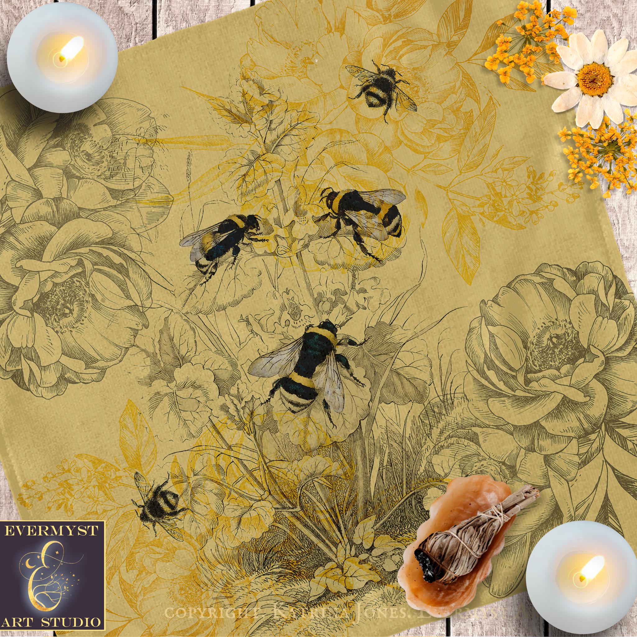 a table topped with bees and flowers next to candles