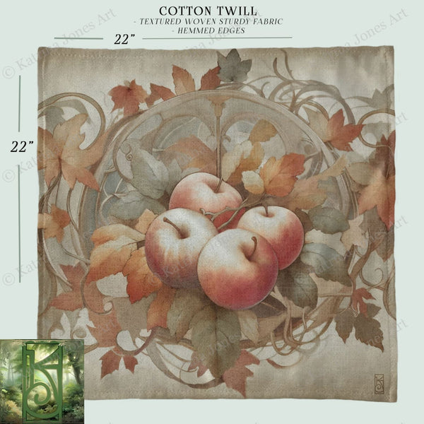 a piece of cloth with apples and leaves on it
