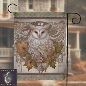 a picture of an owl with leaves on it