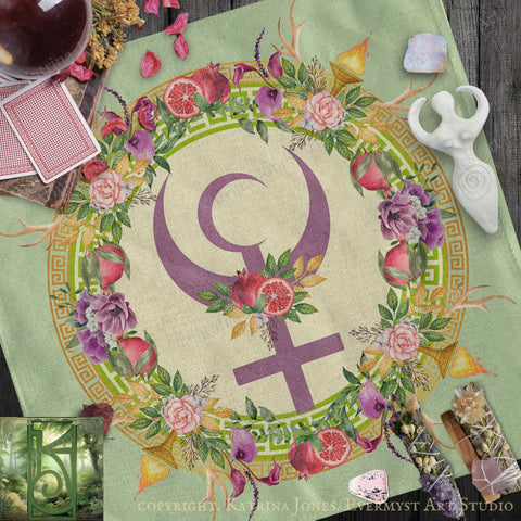 a vibrant and colorful design with a large purple symbol surrounded by a floral wreath, all set against a green background. The design includes various flowers, leaves, and a crescent moon, creating a visually striking and intricate composition.