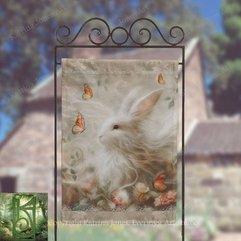 a white rabbit with a floral background, surrounded by butterflies, displayed on a banner.