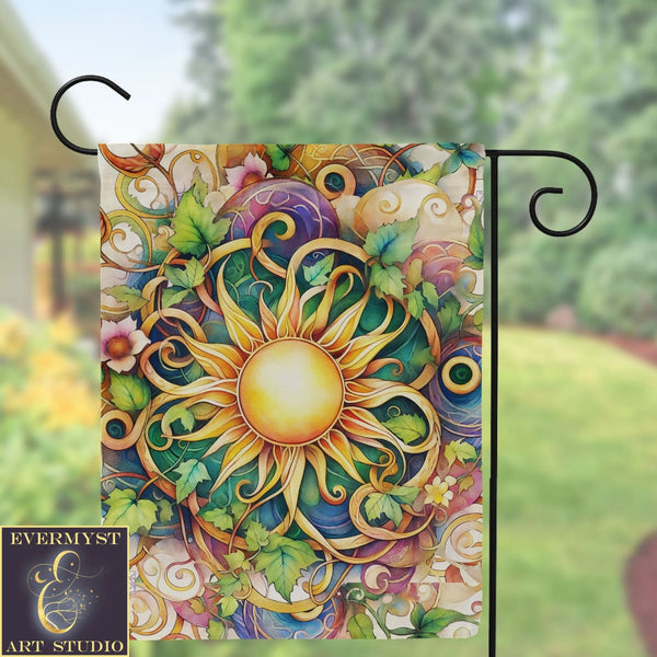 a garden flag with a sun design on it