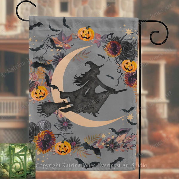A Halloween-themed flag with a silhouette of a witch on a broomstick, surrounded by pumpkins, flowers, and bats against a crescent moon backdrop.