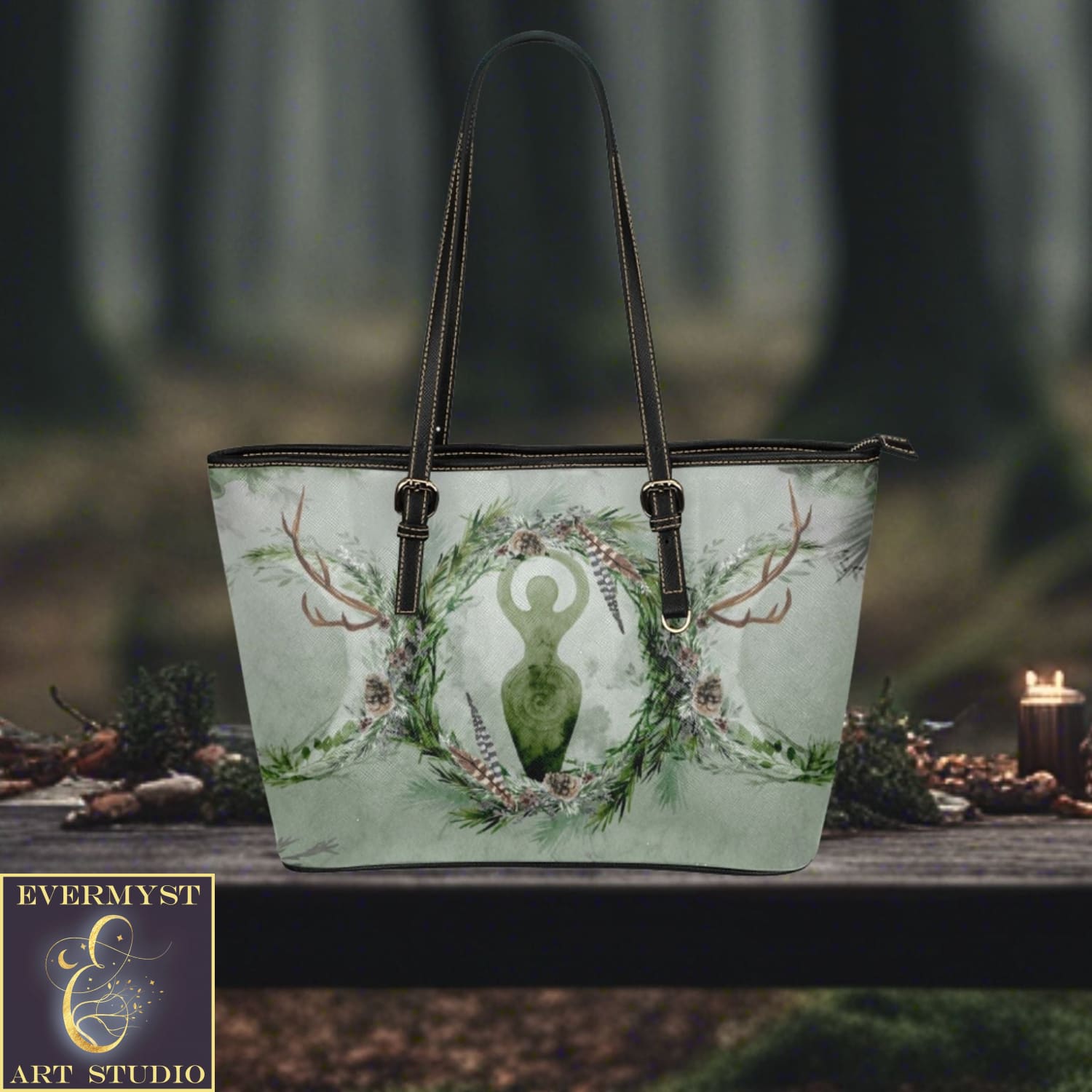 a handbag with a deer on it sitting on a table